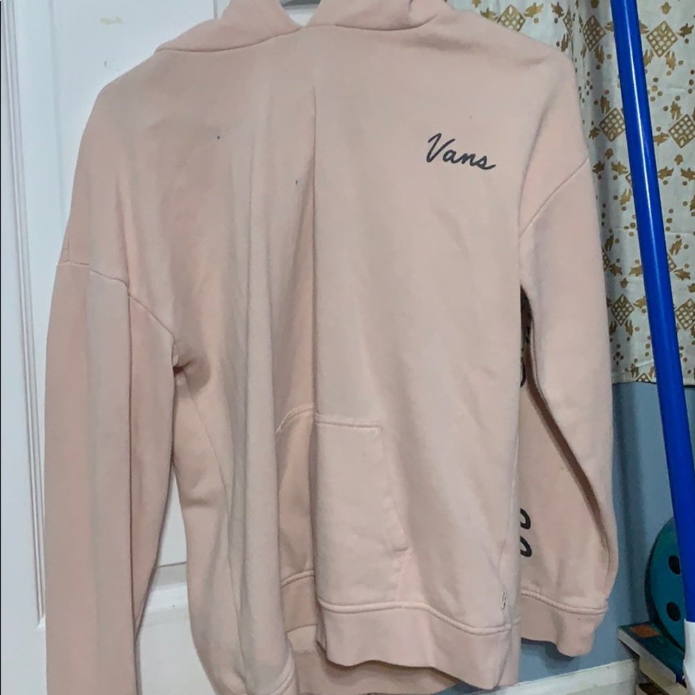 A light pink vans sweatshirt